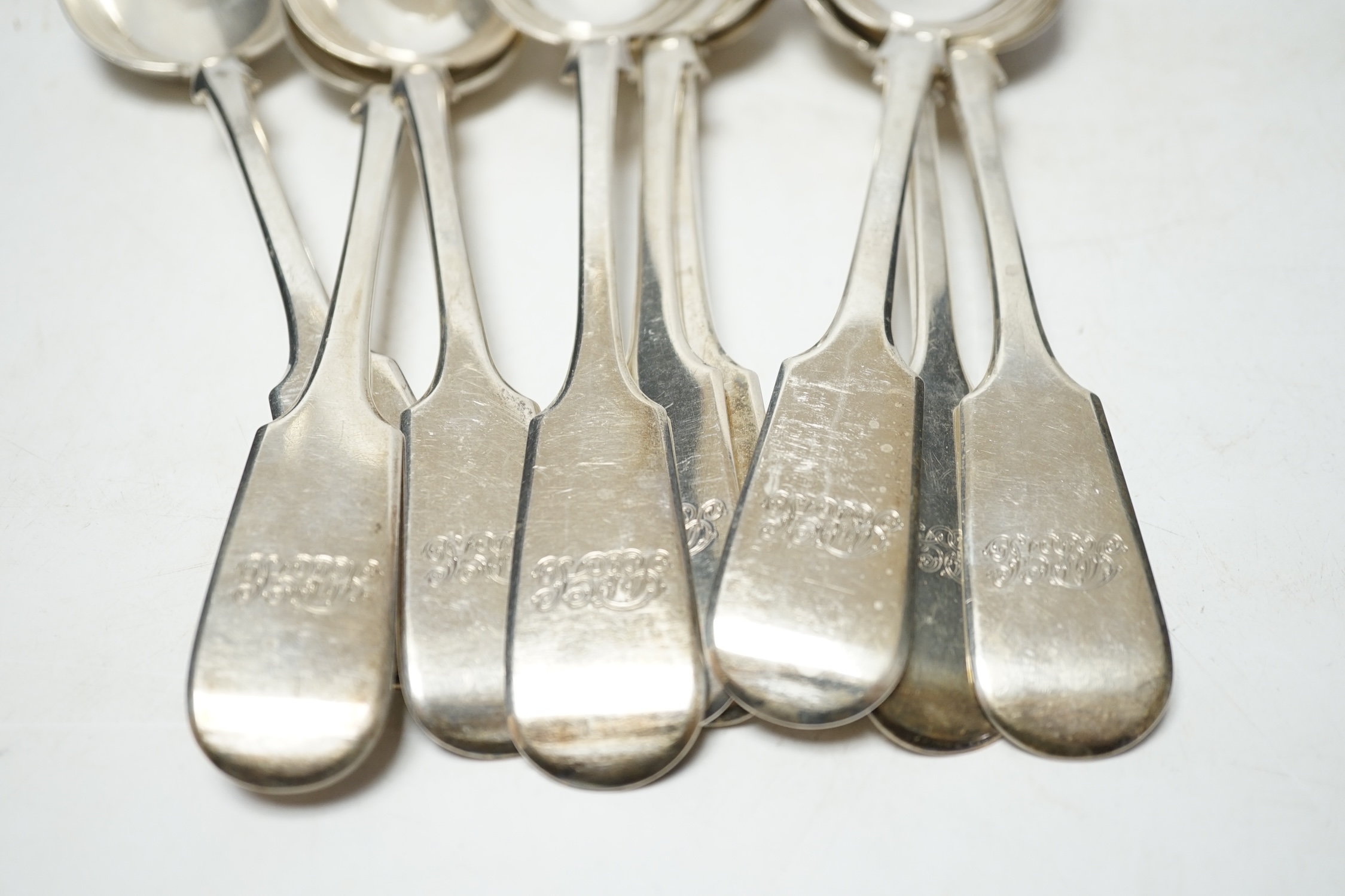 A set of twelve Victorian provincial silver fiddle pattern tablespoons, by Robert Williams & Sons, Exeter, 1852, 22.8cm, 30.4oz. Condition - fair